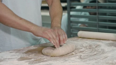 The cook rolls out the dough. Stock Footage 92579886