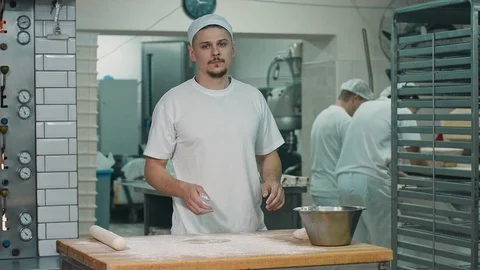 The cook rolls out the dough. Stock-Footage 92581492