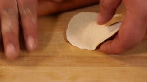 Cook rolls out pancakes (2) Stock Footage 202163456