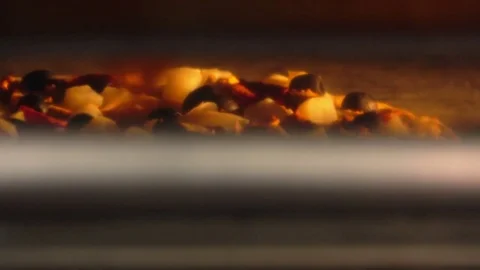 Cook rotates the pizza inside the oven Stock Footage 70814374