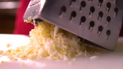 The cook rubs egg on a grater. Work of the cook. Stock Footage 119300400