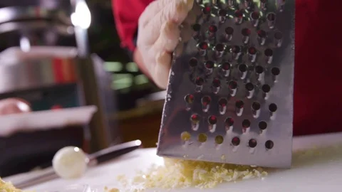 The cook rubs egg on a grater. Work of the cook. Stock Footage 119300403
