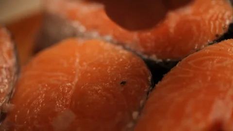 Cook salts a fish Video stock 100123554