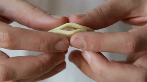 The cook sculpts dough Stock Footage 67572040