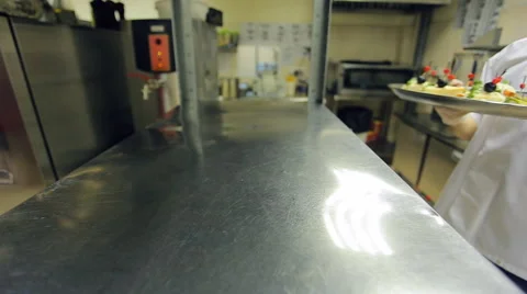 Cook sends waiter a tray of various cold cuts, vegetables Stock-Footage 65745398