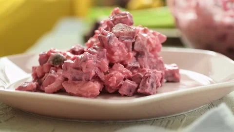 The cook serves beet and potato salad on the plate. Stock Footage 234892061