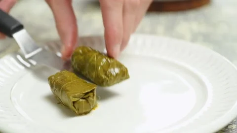 The cook serves Dolmas on the plate. Stock Footage 207020648