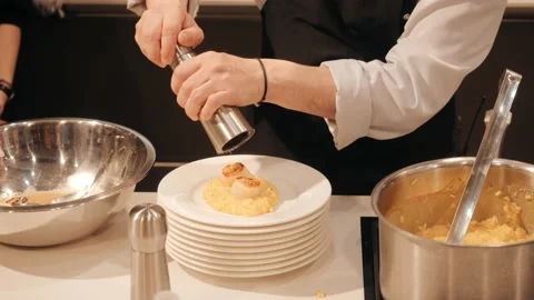 The cook serves the finished dish Stock Footage 151517779