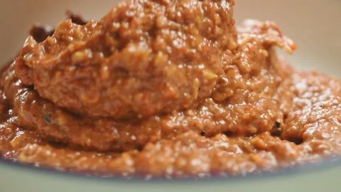 The cook serves roasted red pepper dip. Stock Footage 200810630