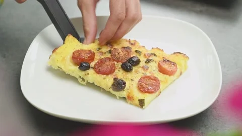 The cook serving baked polenta with cherry tomatoes. Stock Footage 166341055