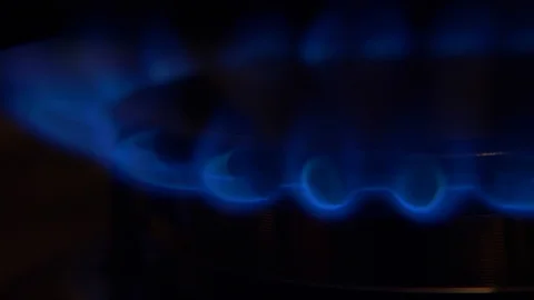 Cook sets fire to the stove burner turning on Stock Footage 103972124
