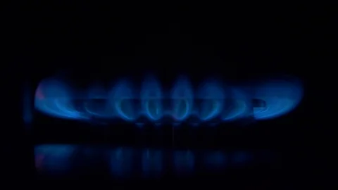 Cook sets fire to the stove burner turning on Stock Footage 103972341