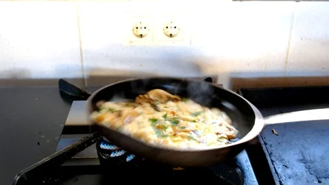 Cook shaking the omelette Stock Footage 116446374