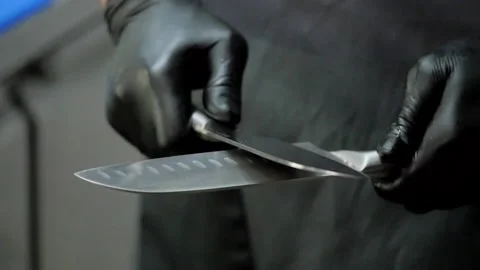 The Cook is Sharpening Knives Stock Footage 132100851