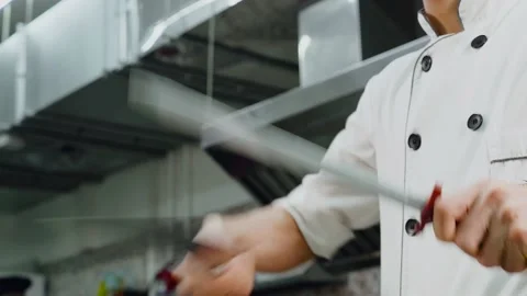 Cook sharpens a knife. Stock Footage 141777447