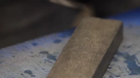 Cook Sharpens Knife on Grindstone Stock Footage 261588974