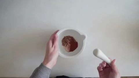 The cook shows how to use a mortar and pestle for grinding spices correctly Stock Footage 169835024