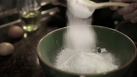 A cook sieves flour to make it airier before making dough Stock-Footage 80666137