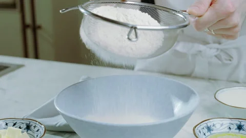 Cook sifting flour through sieve. Baking, cooking, pastry concept. Stock Footage 263492176