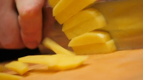 The cook sliced potato with a knife. Closeup Stock Footage 271501034