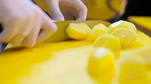 Cook sliced potatoes wedges close up Stock Footage