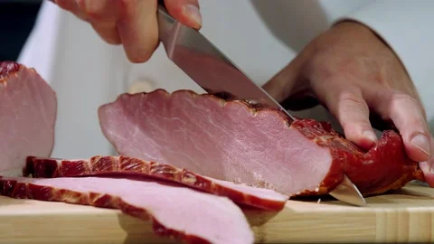 Cook slices bacon Stock Footage 221145796