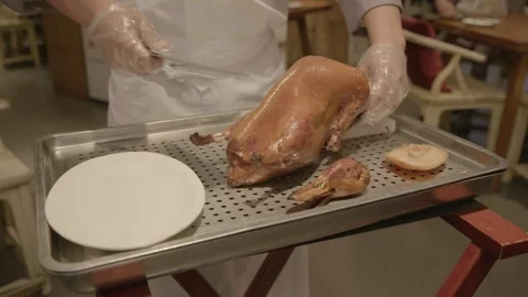 Cook Slicing Roasted Poultry for Serving in Beijing Restaurant Dining Area Stock Footage 345833684