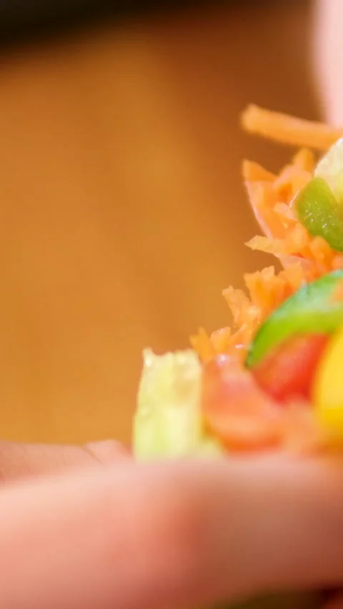 Cook spring rolls with carrots red fish pepper and cucumber vegetables seafood Stock Footage 302730421