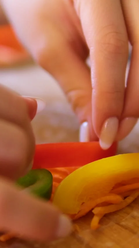 Cook spring rolls with carrots red fish pepper and cucumber vegetables seafood Stock Footage 302730804
