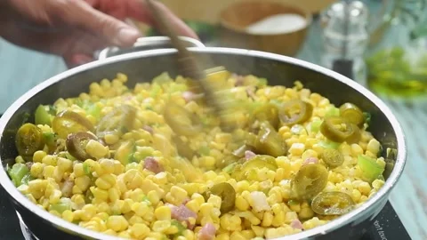 The cook stirs the corn casserole  in the pan. Stock Footage 210717465