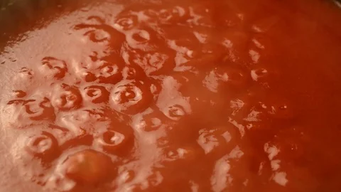 Cook stirs tomato paste in pan Stock Footage 119714201