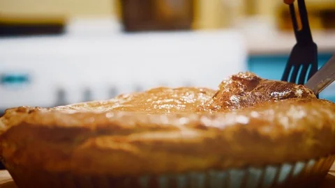 The cook takes away a piece of pie. Stock Footage 102443809