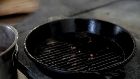 The cook takes the fried meat from the pan Stock Footage 76860845