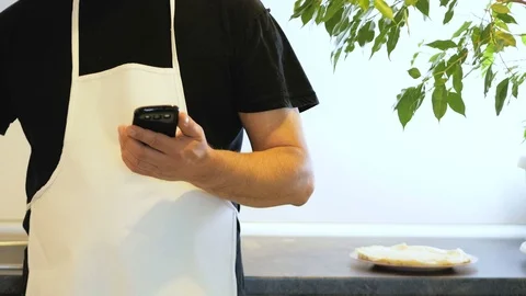 Cook text on smartphone and Turning A Pancake Into A Pan Video stock 75807176