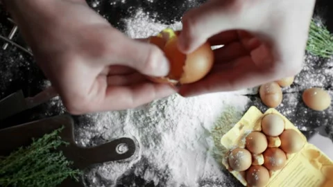 Cook throws an egg into flour, cooking in slow motion Video stock 105416163