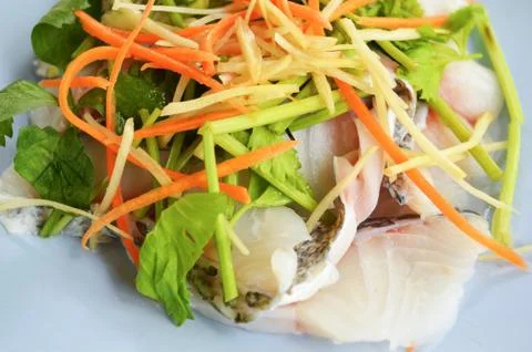 Cook tilapia slice / raw fish fillet slice fresh tilapia fish with vegetable Stock Photos
