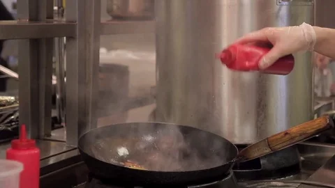 Cook time cooking paste adds sauce from the bottle and stirs Stock-Footage 75817396