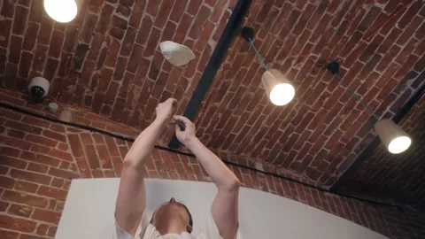 Cook tosses dough to brick ceiling making pizza thinner Video stock 132126194