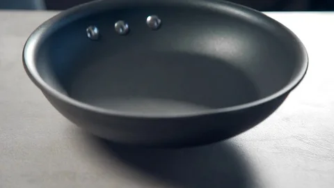 The cook tosses walnuts to the pan for frying, nuts and dried fruits, diet Stock Footage 72979490