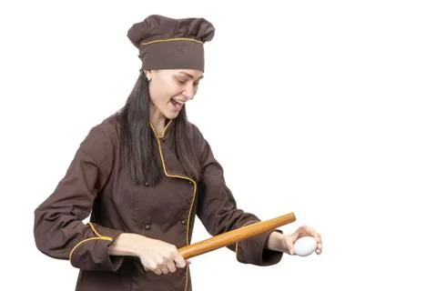 Cook trying to break an egg Stock Photos