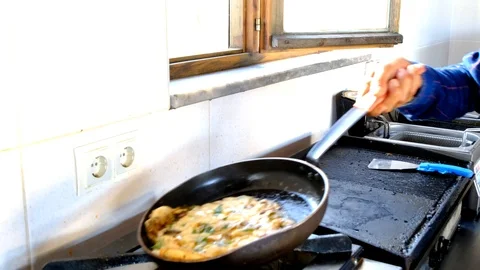 Cook turning the omelette Stock Footage 116446367