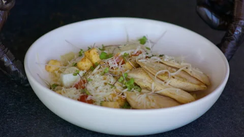 Cook turns the dish on the table. Video stock 158790750