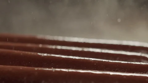 Cook turns forceps fried sausages on an electric stove for cooking hot dogs Stock Footage 117295887