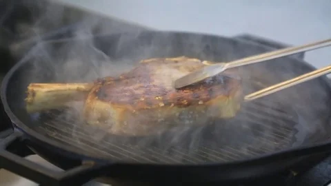 Cook Turns Over Beef Fillet Steak To Reveal Caramelized Meat Stock Footage 83590643