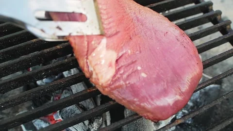 Cook turns raw beef steak piece Video stock 157136307