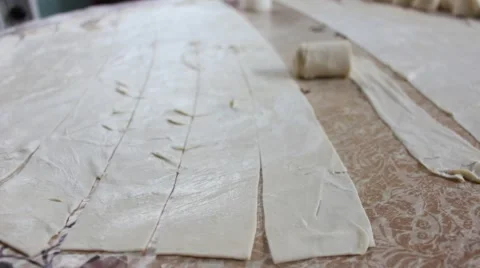Cook twists roll dough. Stock-Footage 46888624