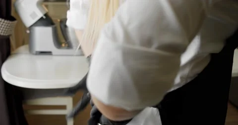 Cook tying a kitchen apron in the kitchen. Close-up V3 Stock Footage 140413596