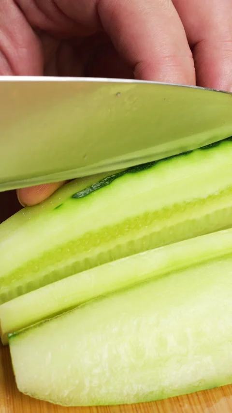 The cook uses precise movements to cut the vegetable. Stock Footage 342285509
