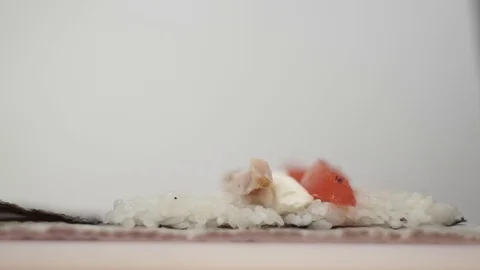 The cook using the mat twists the rolls Stock Footage 106670162