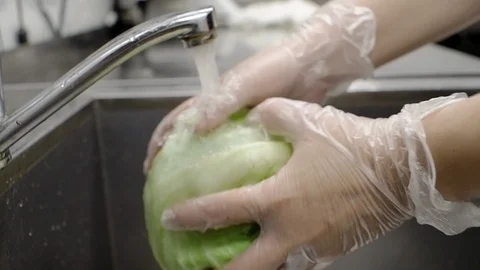 The cook washes the salad. Stock Footage 114890271